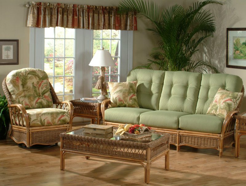 indoor wicker furniture with printed and plain green cushions