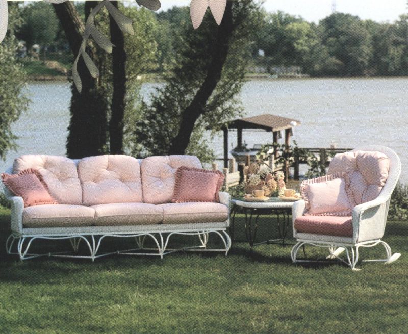 white furniture with different shades of pink cushions
