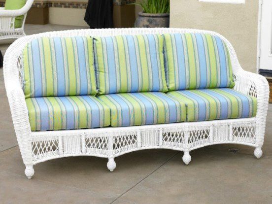 white wicker furniture with blue and green striped cushions