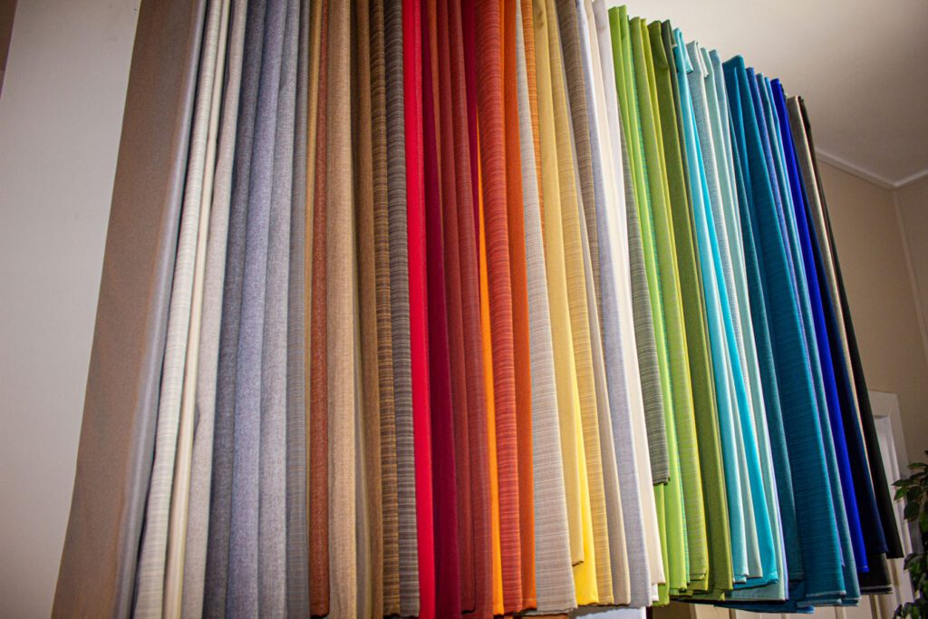 A rack of different fabrics to be used on.